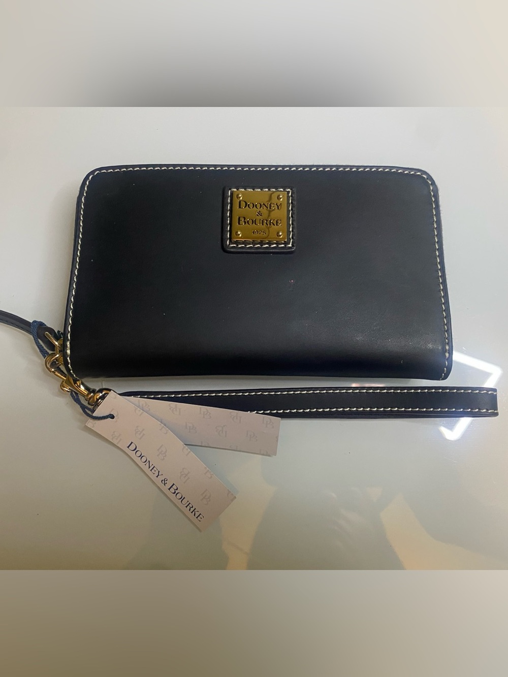Dooney & Bourke Black Leather Zip-Around Wallet with Gold Plaque